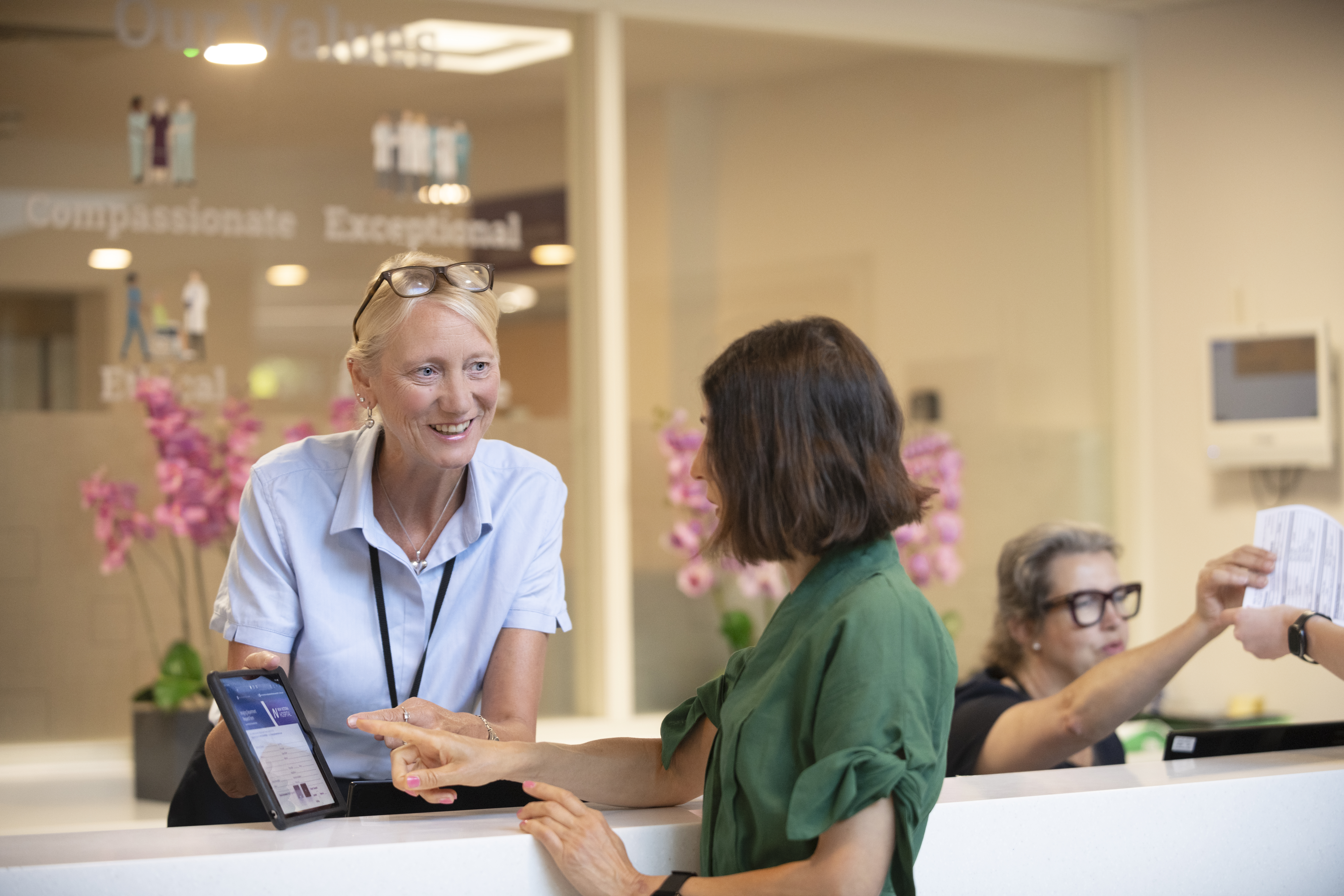 New Victoria Hospital receptionist talking to a patient