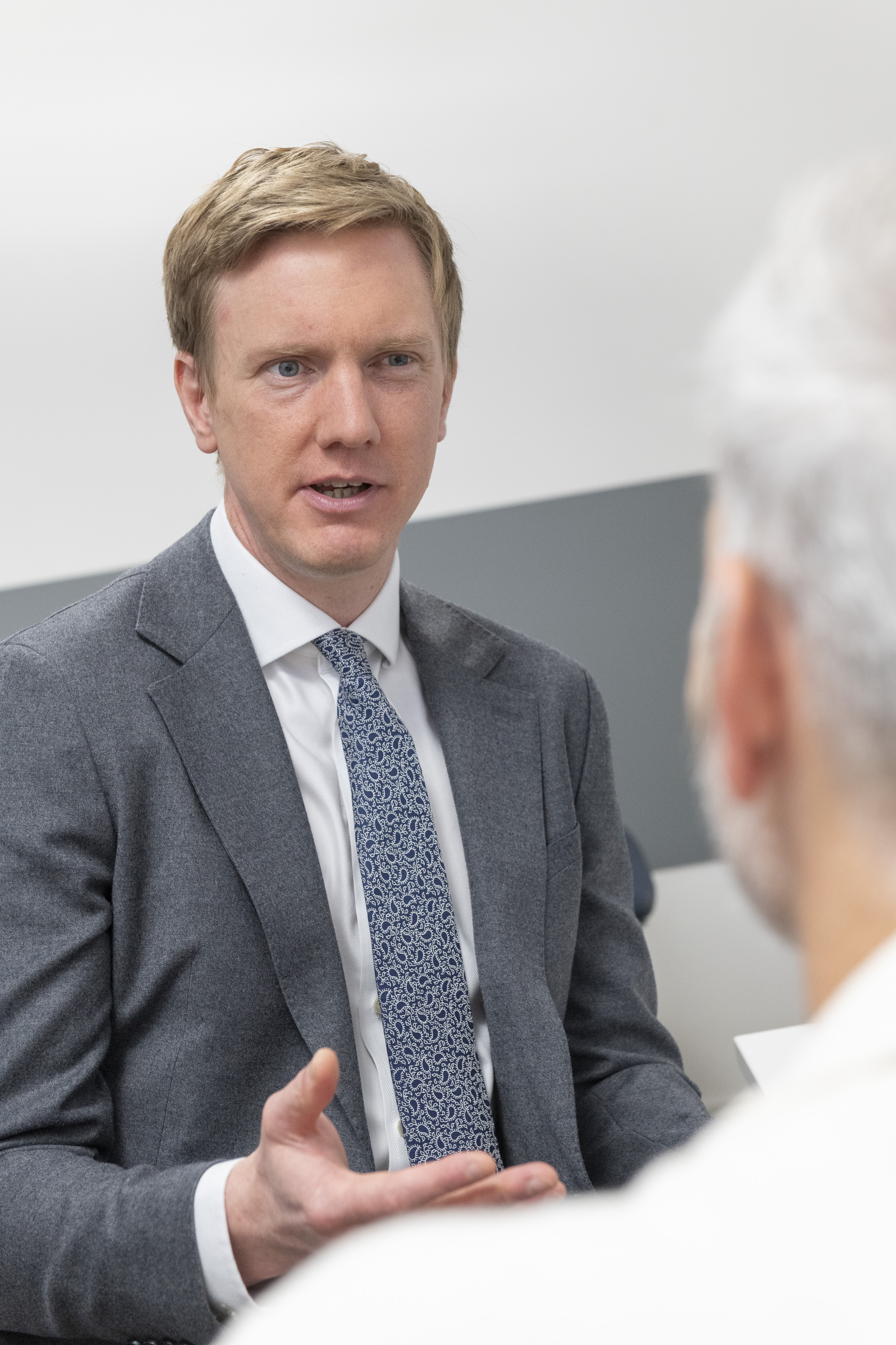 Mr Simon Hislop talking to a patient